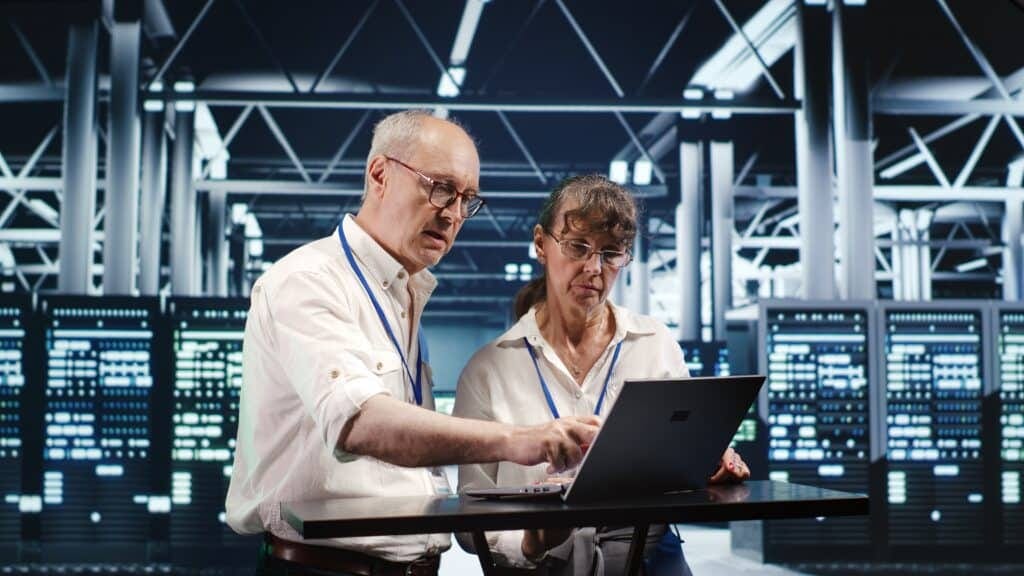 Colleagues crosschecking server parts